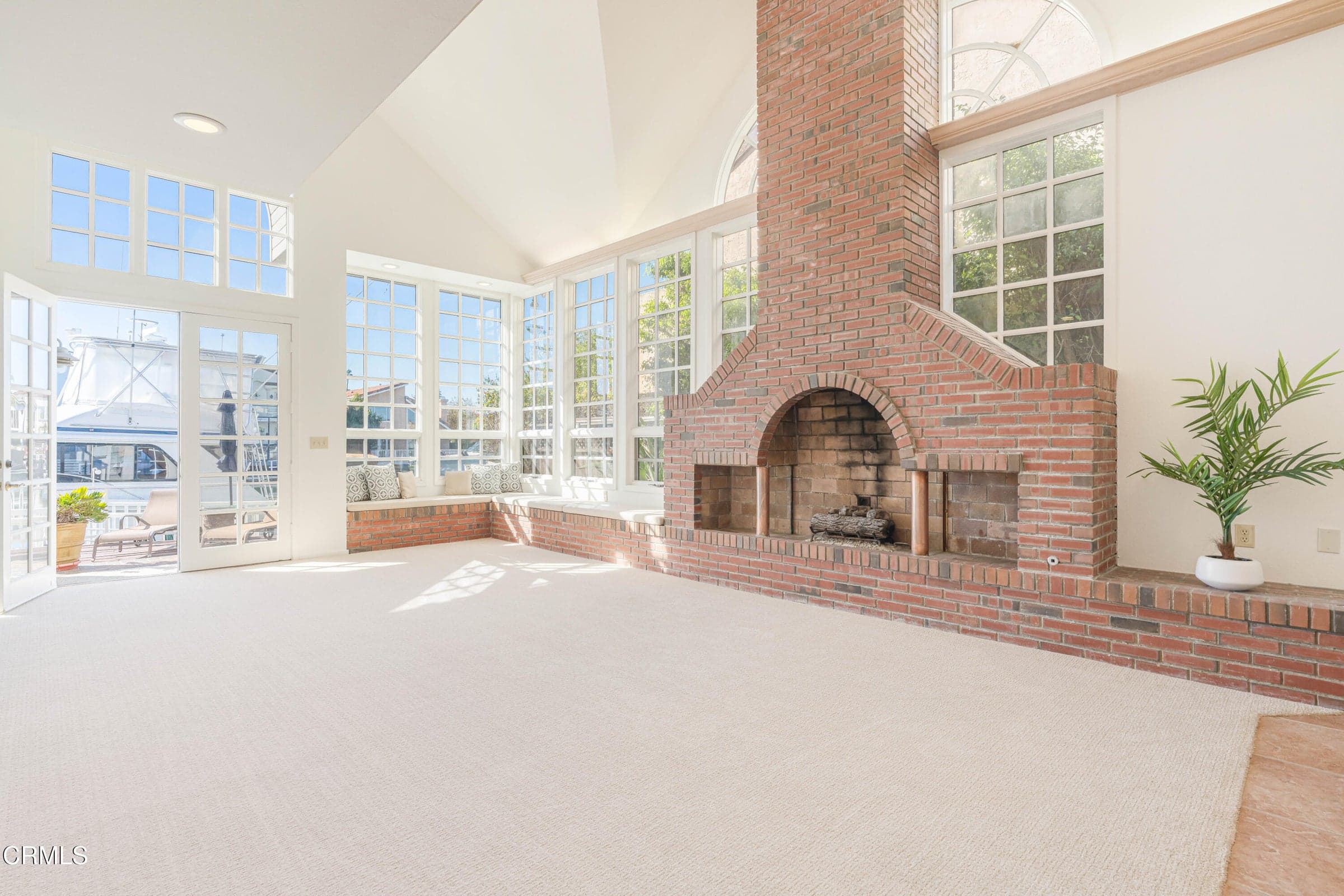 Breathtaking brick fireplace is focal point of the large living room.