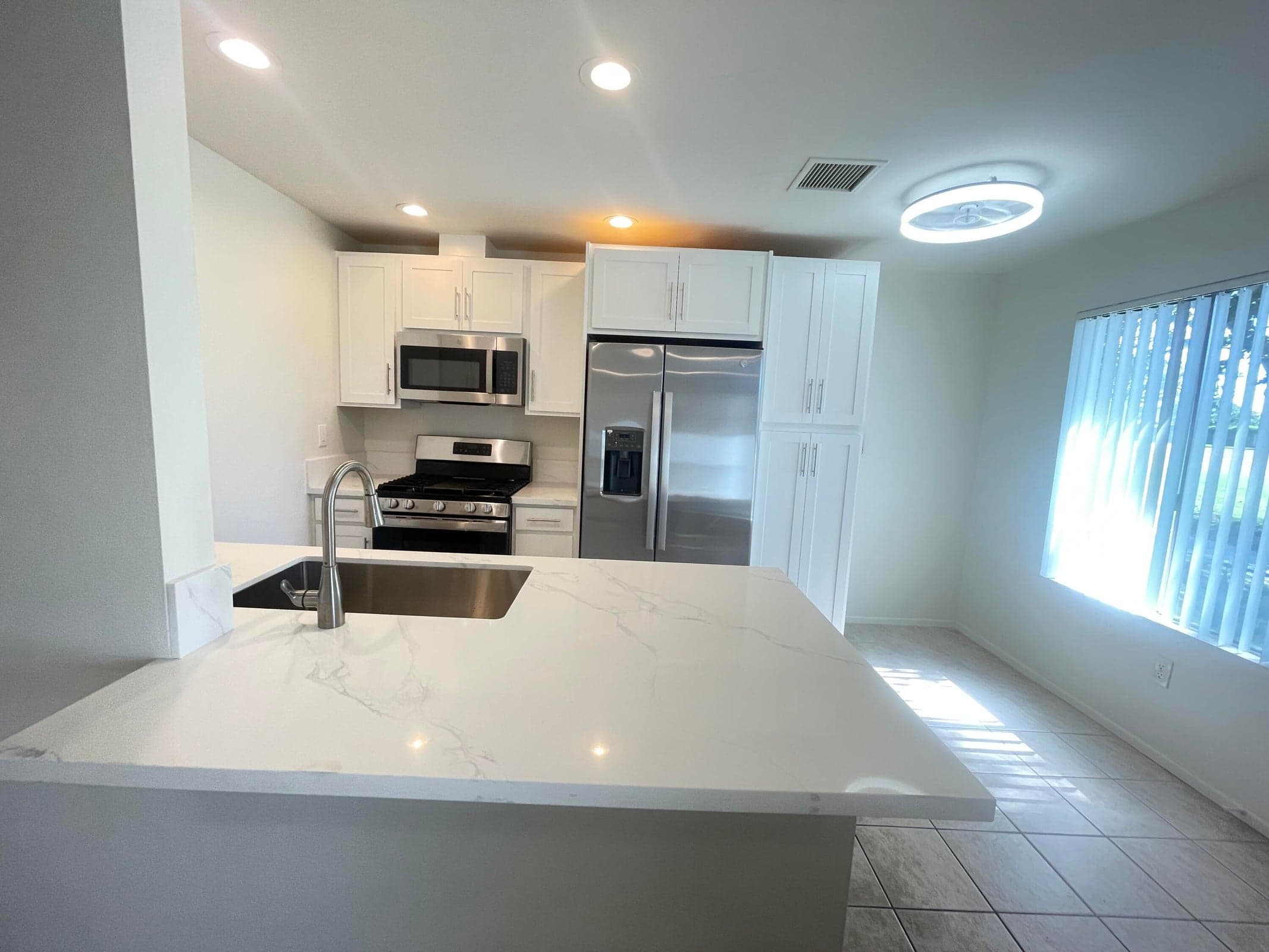 Gorgeous New Kitchen. All New Cabinets, Counter top, Farm Sink, All New Appliances. Room for bar stools and small Breakfast Nook in front of New Window arriving soon.