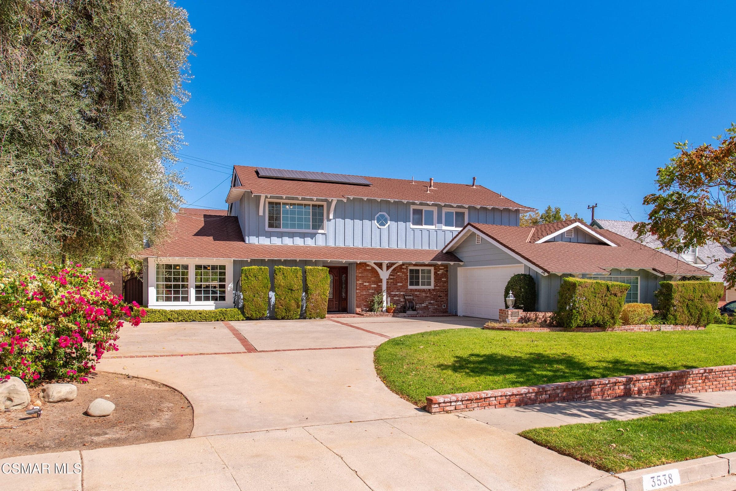 Beautiful curb appeal with manicured landscaping